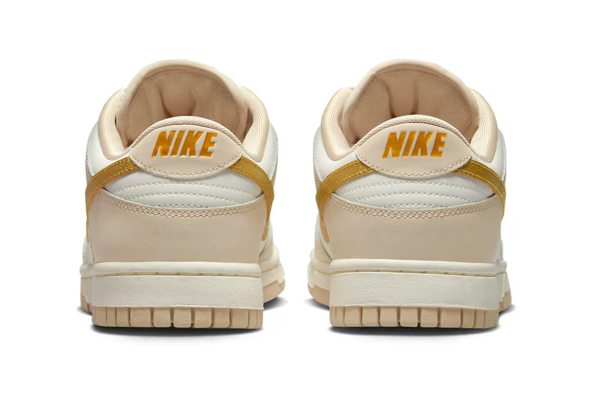 Nike Dunk Low Surfaces With Golden Swooshes